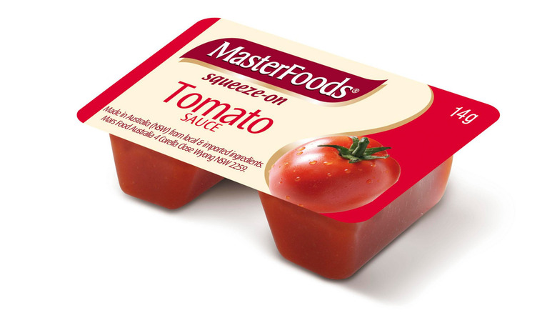 MasterFoods squeeze-on tomato sauce packet against a white background