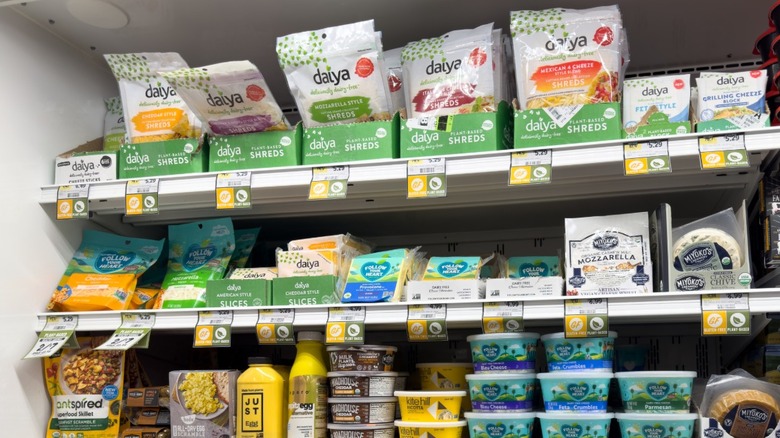 Brands of vegan cheeses on grocery store shelf