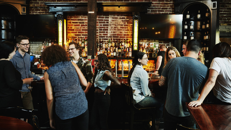 People enjoying each other's company at a bar.