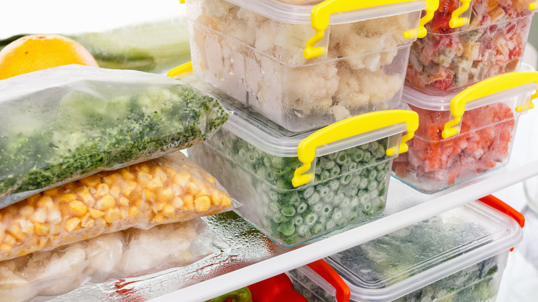 Packaged food in containers in a freezer