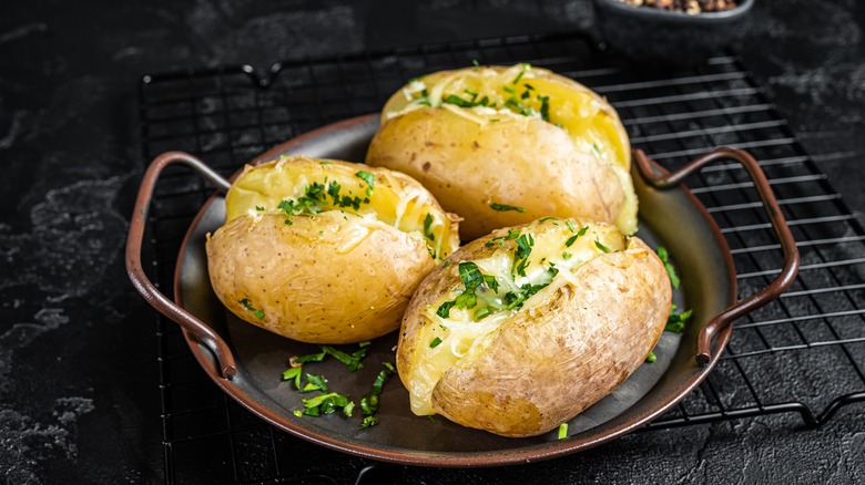 Three cheesy baked potatoes