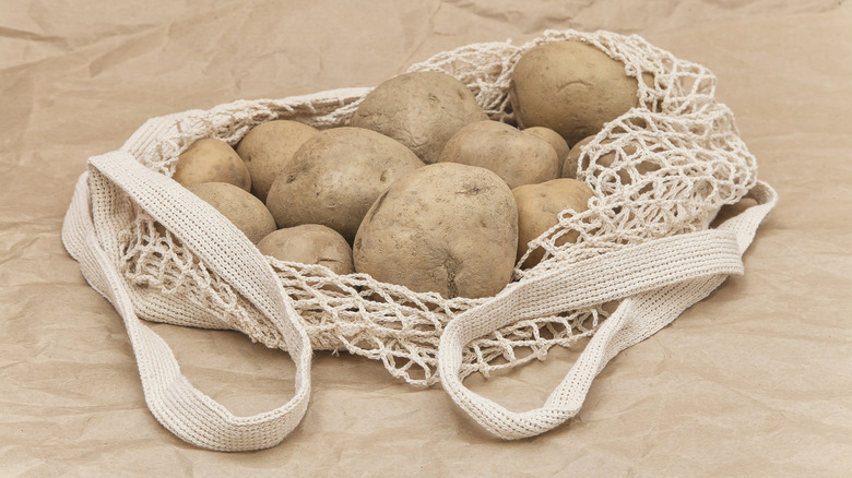 Reusable grocery bag with potatoes