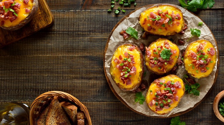 Plate of baked potatoes with toppings