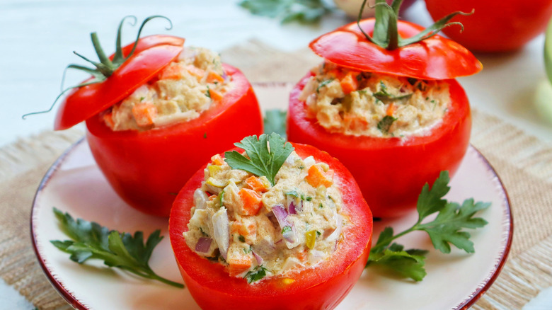 Tuna salad stuffed tomatoes with garnishes