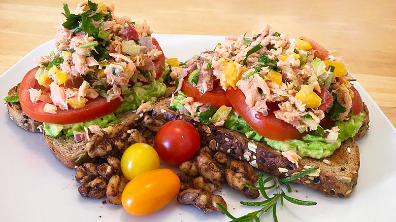 Open-faced tuna salad sandwich with avocado and tomato