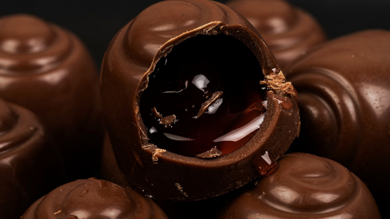 Open cordial cherry with dark cherry and syrup inside