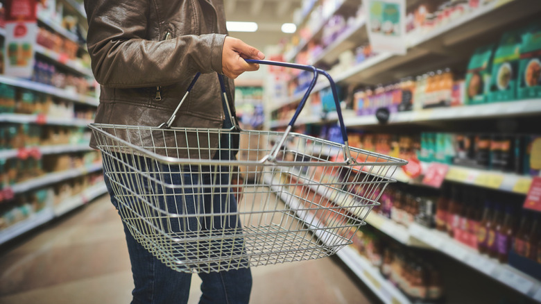 A person shopping in a grocery store.