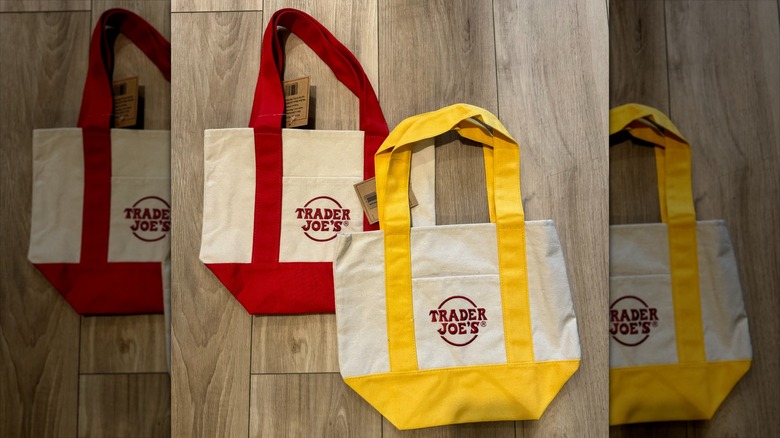 Two Trader Joe's tote bags placed on the floor.