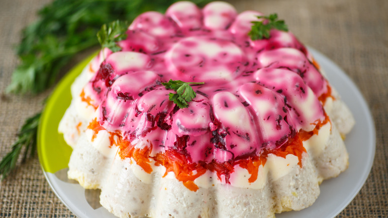 Jell-O herring salad with beets and carrots.