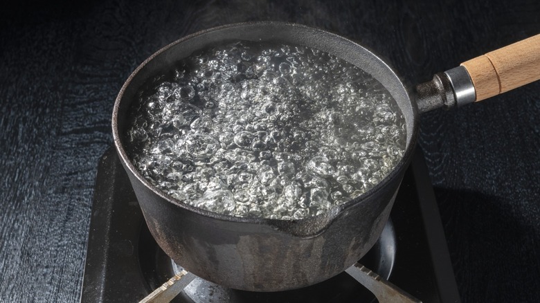 Boiling water in an iron pot