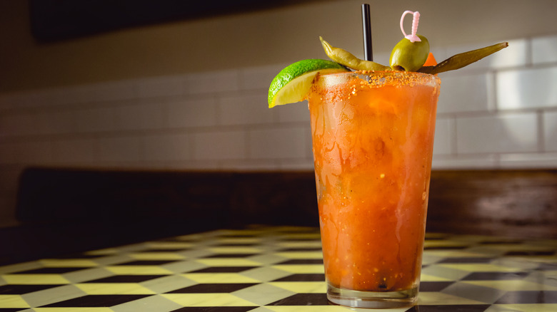 a bloody mary with garnishes