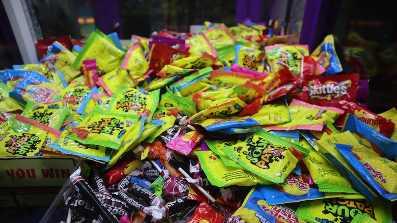 piles of wrapped candy in a gas station store bin