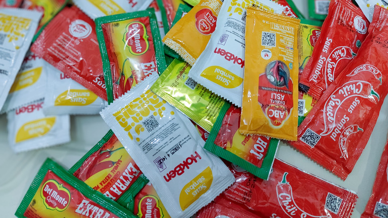 An assortment of fast food sauce packets