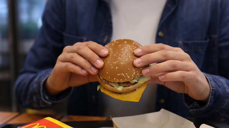 McDonald's hamburger in a man's hands