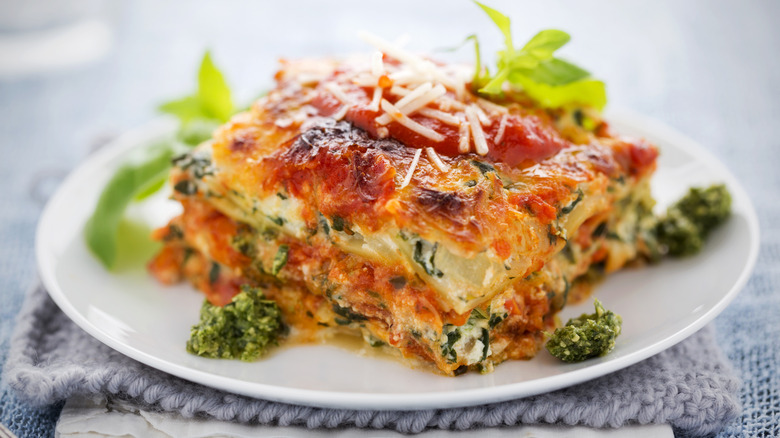 spinach lasagna on a white plate