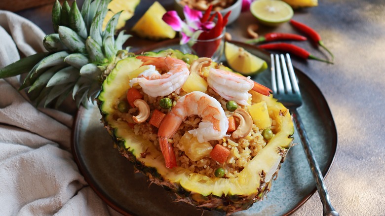 fried rice with shrimp inside pineapple