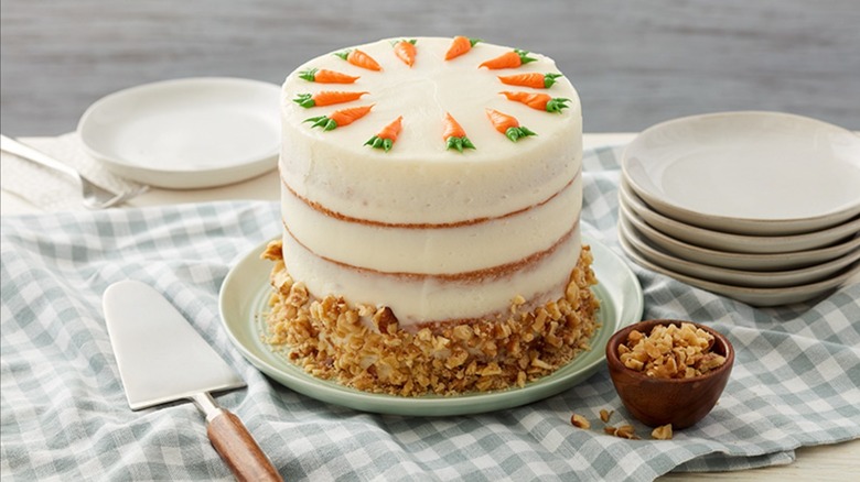 Carrot cake with walnuts and carrot fondant as garnish