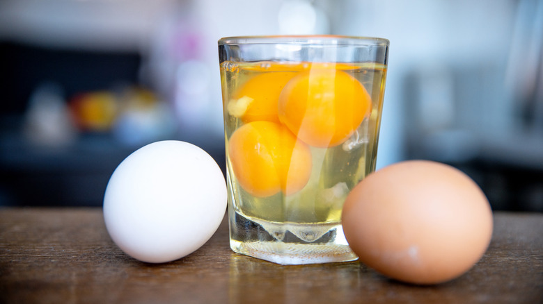 Raw eggs in a glass