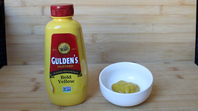 Gulden's bold yellow mustard on a wood background