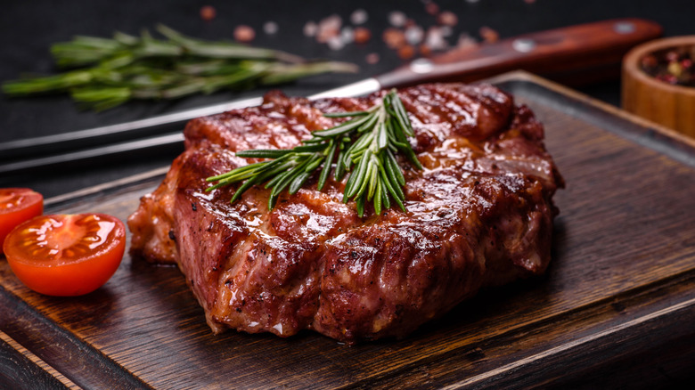 juicy steak on cutting board