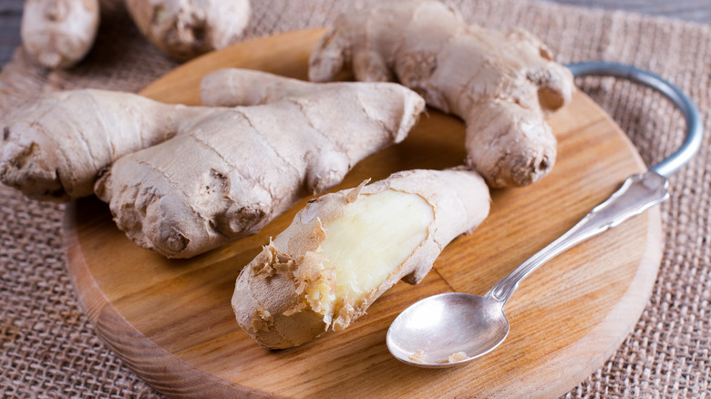 Ginger and spoon on cutting board