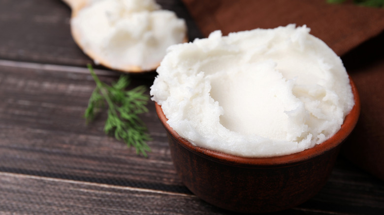 Close up shot of lard in a wood bowl