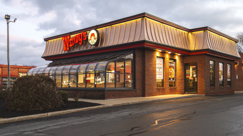 The exterior of a Wendy's location at dusk