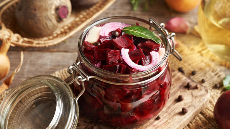 Beetroot marinated with onion and garlic in a glass jar