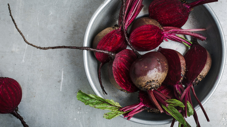 Fresh, raw beetroots in a saucepan