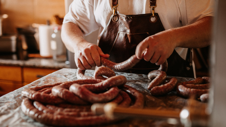 Person making homemade sausage