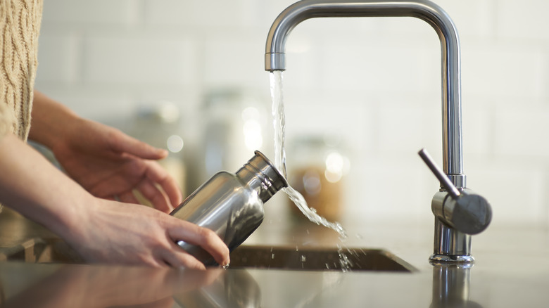 A water bottle being washed