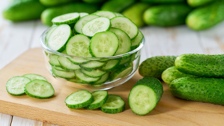 pile of whole and sliced cucumbers